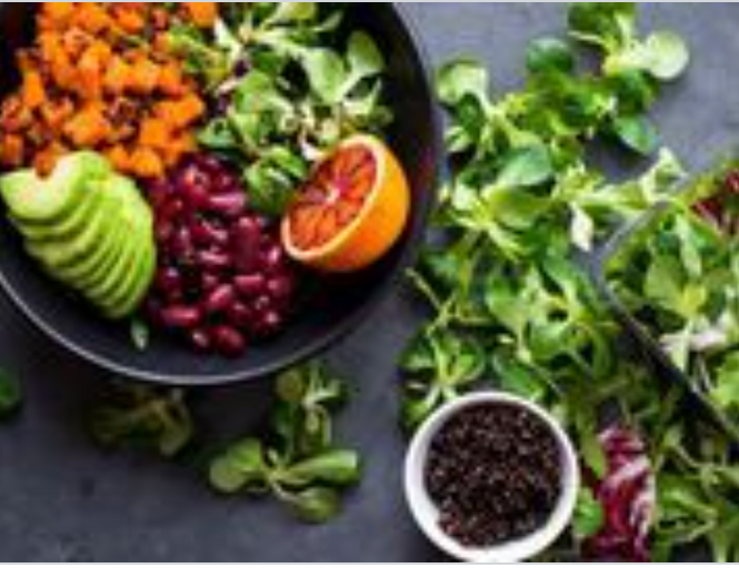 dishes of fresh fruits and vegetables on table