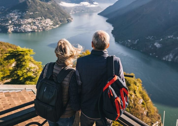 two people overlooking lake