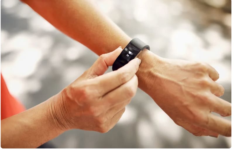 hands showing function of smart exercise watch