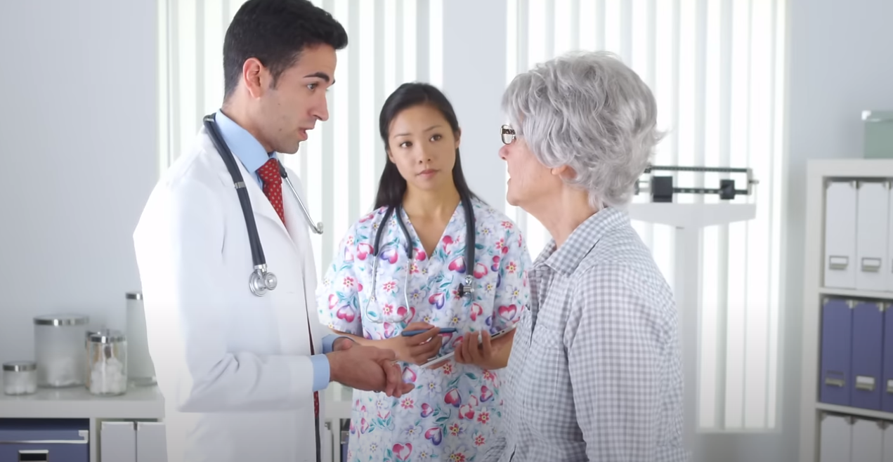 doctor nurse and elderly patient in consultation